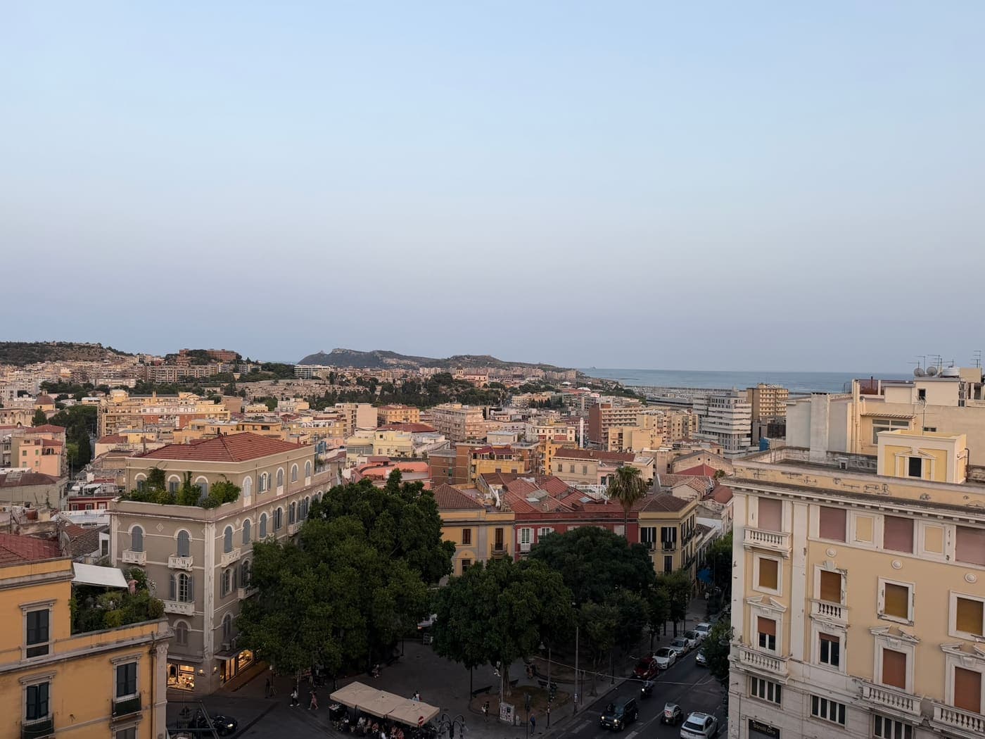 Terracotta rooftops of Cagliari stretching down to the sea